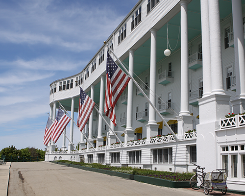 Michigan government building with American flags flying